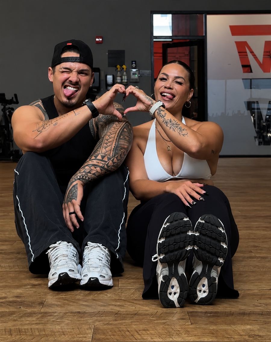 Britt and Kimo making a heart with their hands
